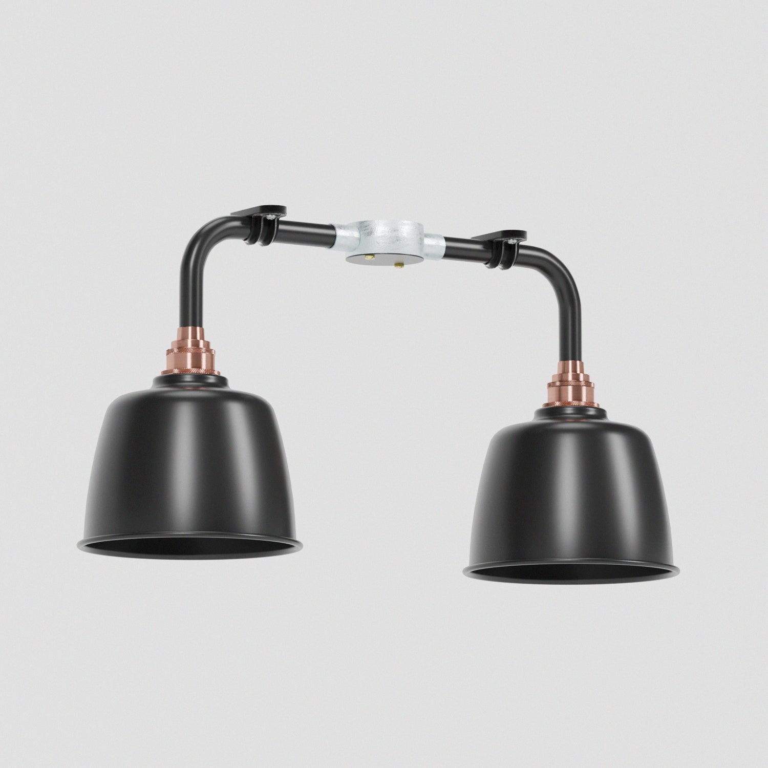 A vintage industrial style ceiling light fixture with two black shades