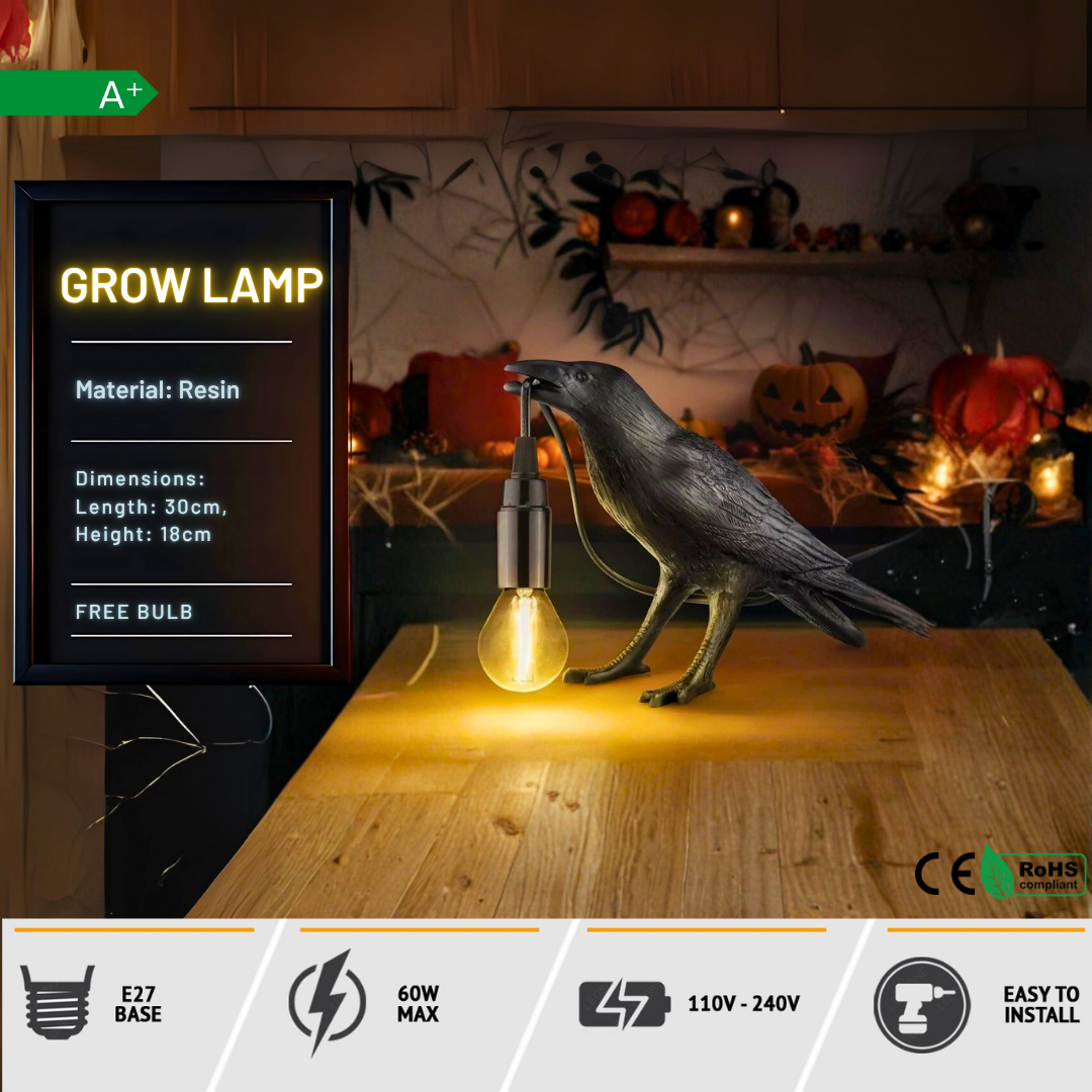 Decorative crow lamp with grow light on a wooden surface, Halloween-themed background.