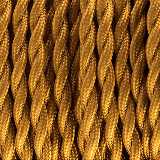 Close-up of a twisted gold-colored fabric electrical cable.