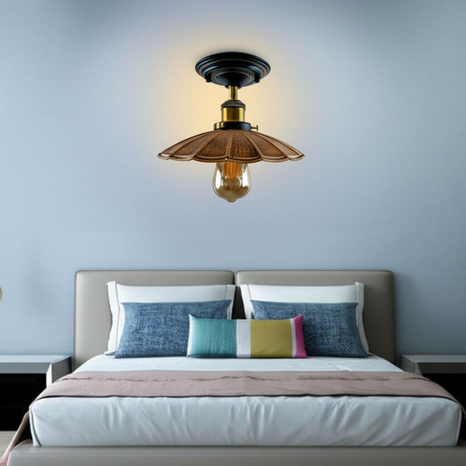 Ceiling light fixture above a bed