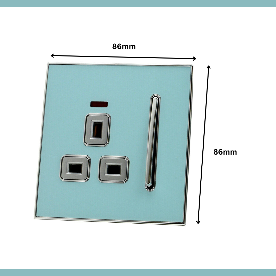 Decorative UK plug socket with a glossy blue face and satin gold inserts A full range of blue glossy plug sockets with gold inserts  Blue glossy decorative plug socket in a modern room