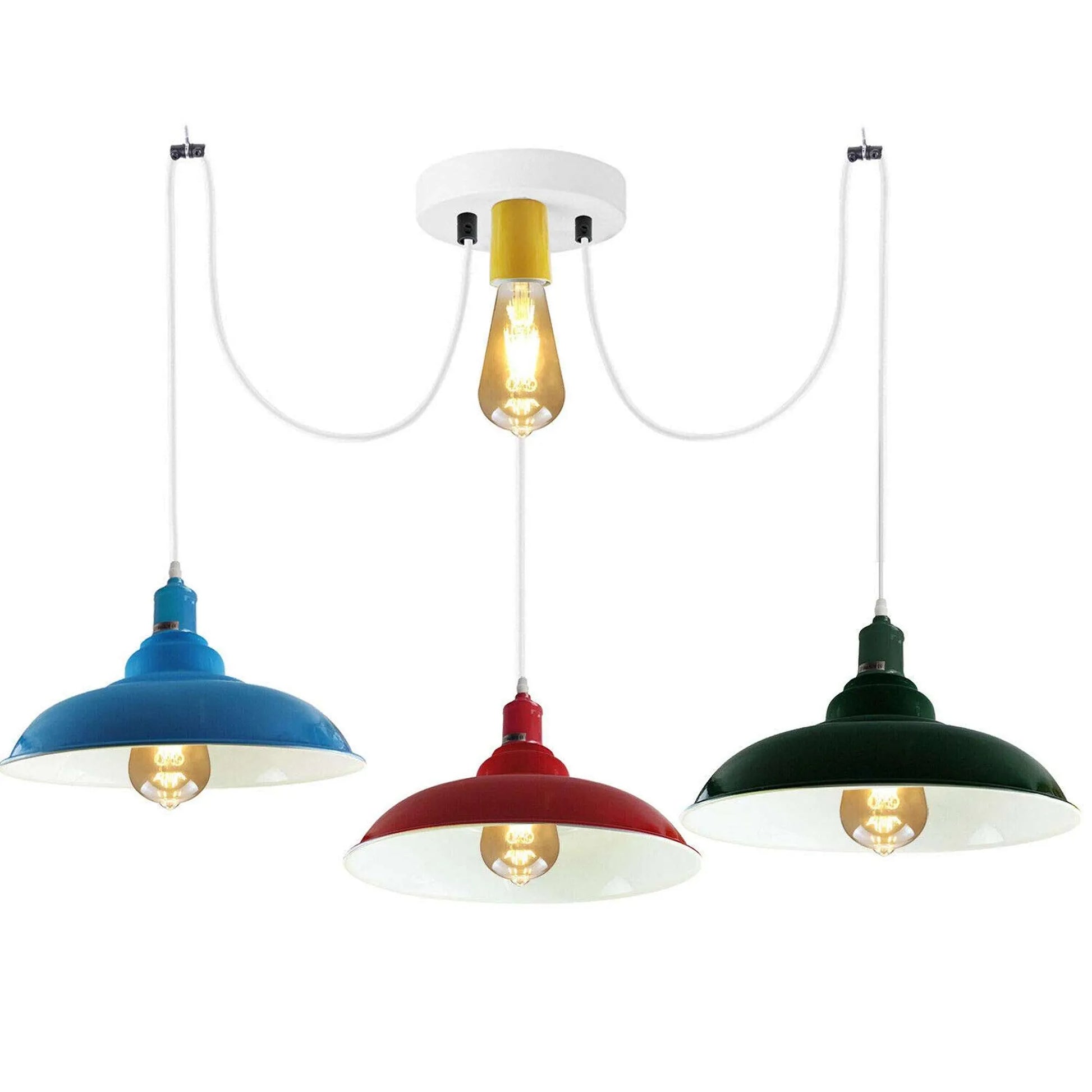 Three pendant ceiling lights with adjustable cables, each in different colors (blue, red, and green) and a central white metal ceiling rose.