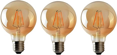 Three vintage-style light bulbs with a warm glow on a white background