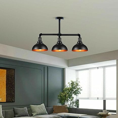 Modern living room with a three-light pendant fixture.