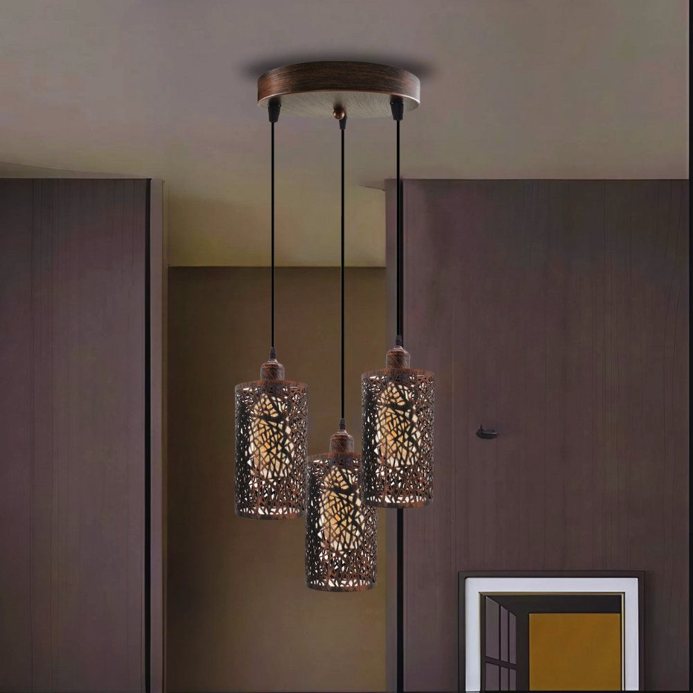 A rustic red ceiling pendant cage light fixture with three heads, hanging from a ceiling mount.