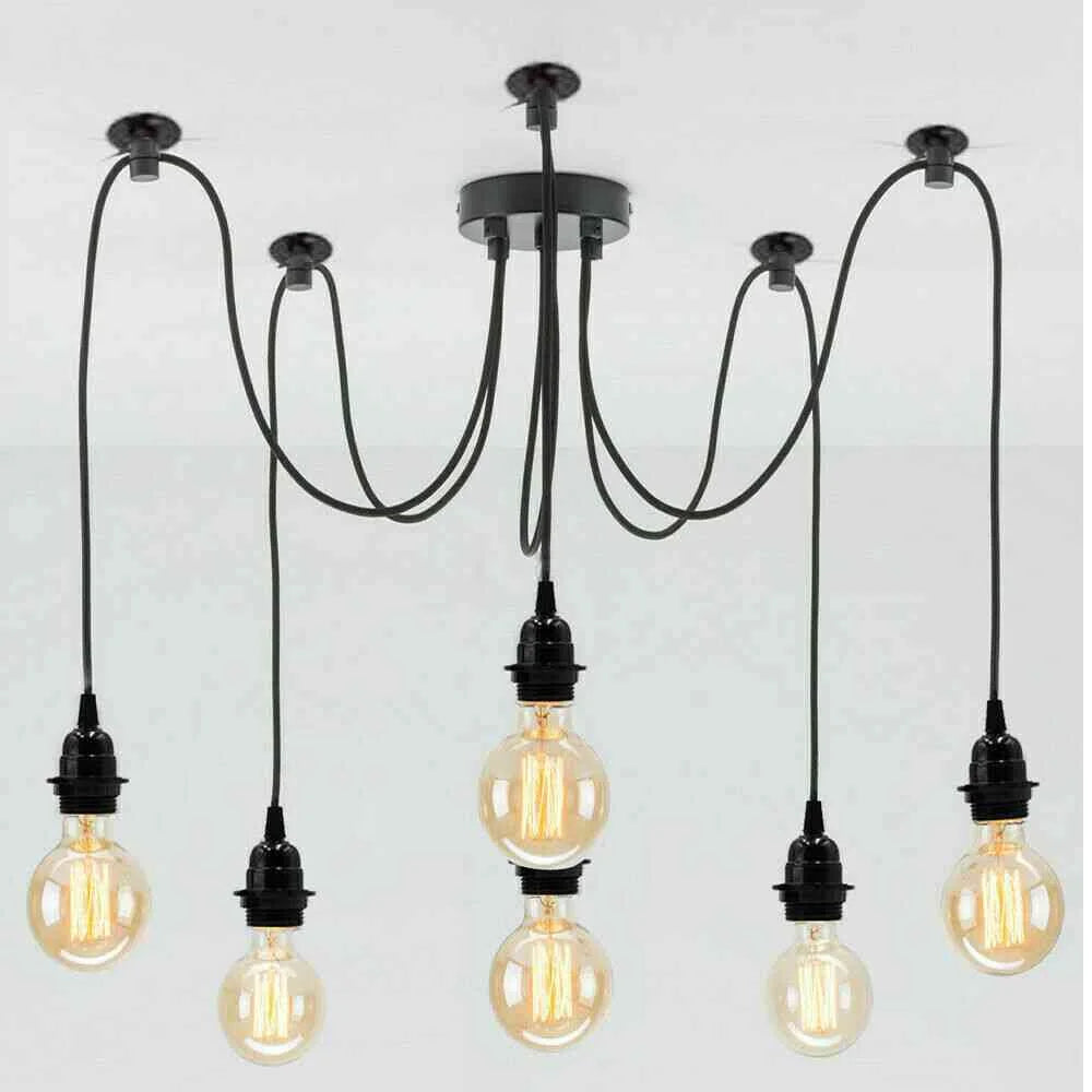 A six-light industrial ceiling fixture with a black metal canopy and six black hanging cords, each ending in a clear glass Edison-style bulb.