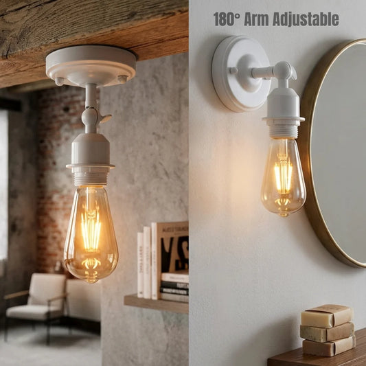 A wall-mounted adjustable light fixture with a white socket and ceiling canopy, shown in a split interior scene. One side shows the light hanging from a wooden ceiling, and the other shows it mounted on a white wall beside a round mirror.