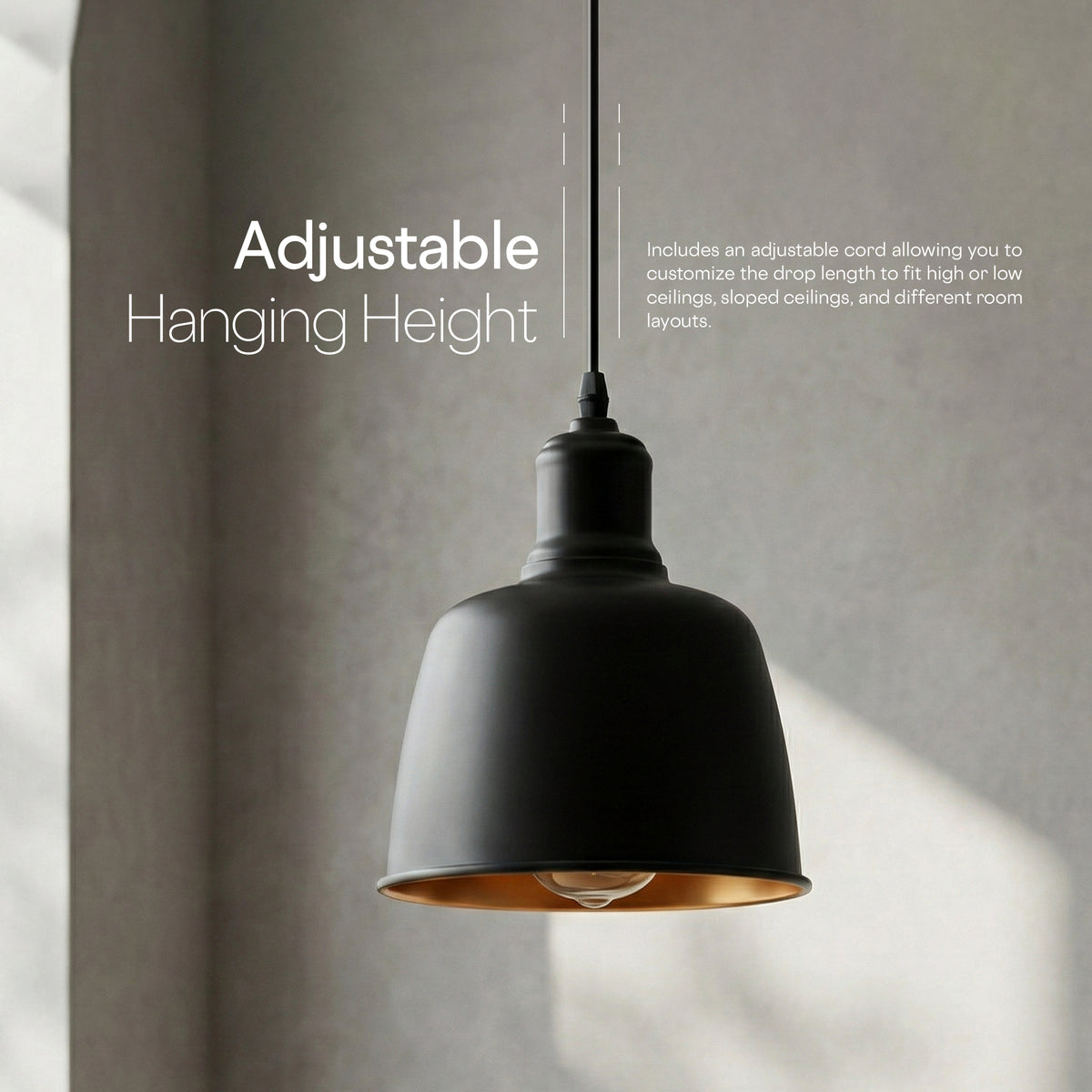 A matte black adjustable pendant light with a warm copper interior, hanging against a textured gray wall with soft sunlight shadows. White text on the left reads 'Adjustable Hanging Height' with additional descriptive text on the right.