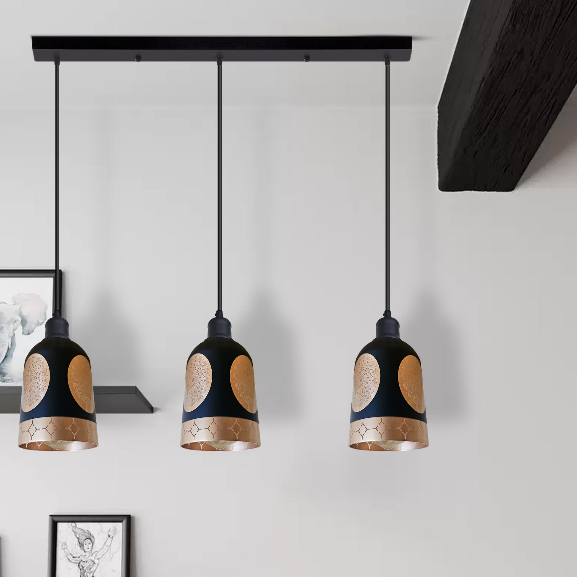 Three pendant lights with black and gold design hanging from a ceiling.