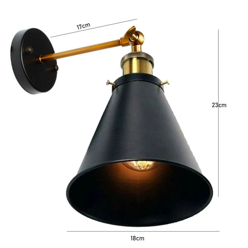 An industrial black metal adjustable wall sconce with a gold arm and cone-shaped shade is shown with dimensions