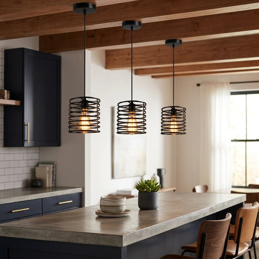 Three black metal cage pendant lights hang over a kitchen island in a modern kitchen with dark cabinets, a concrete-look countertop, and exposed wooden ceiling beams.