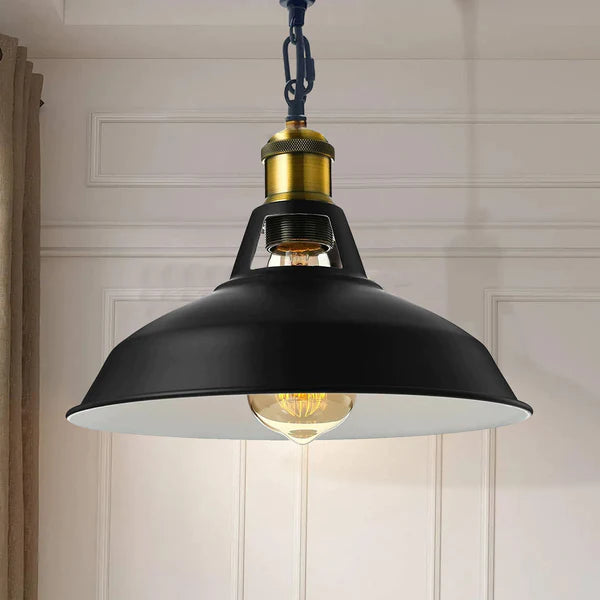 Modern black pendant light hanging from white ceiling