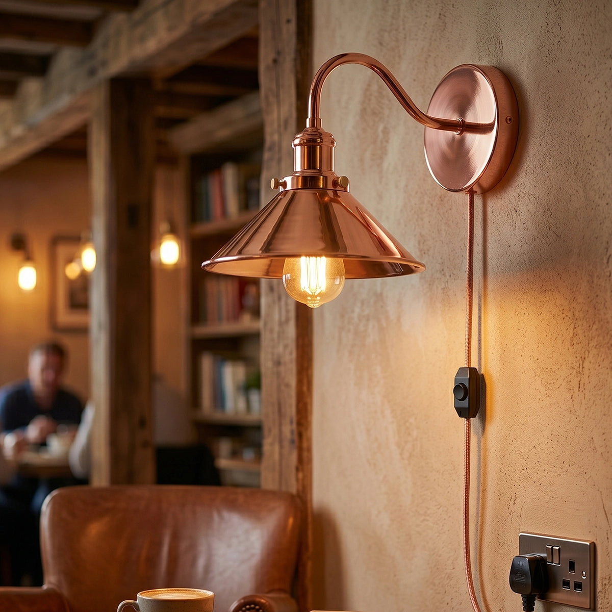 Copper wall lamp with a warm glow in a cozy room setting.