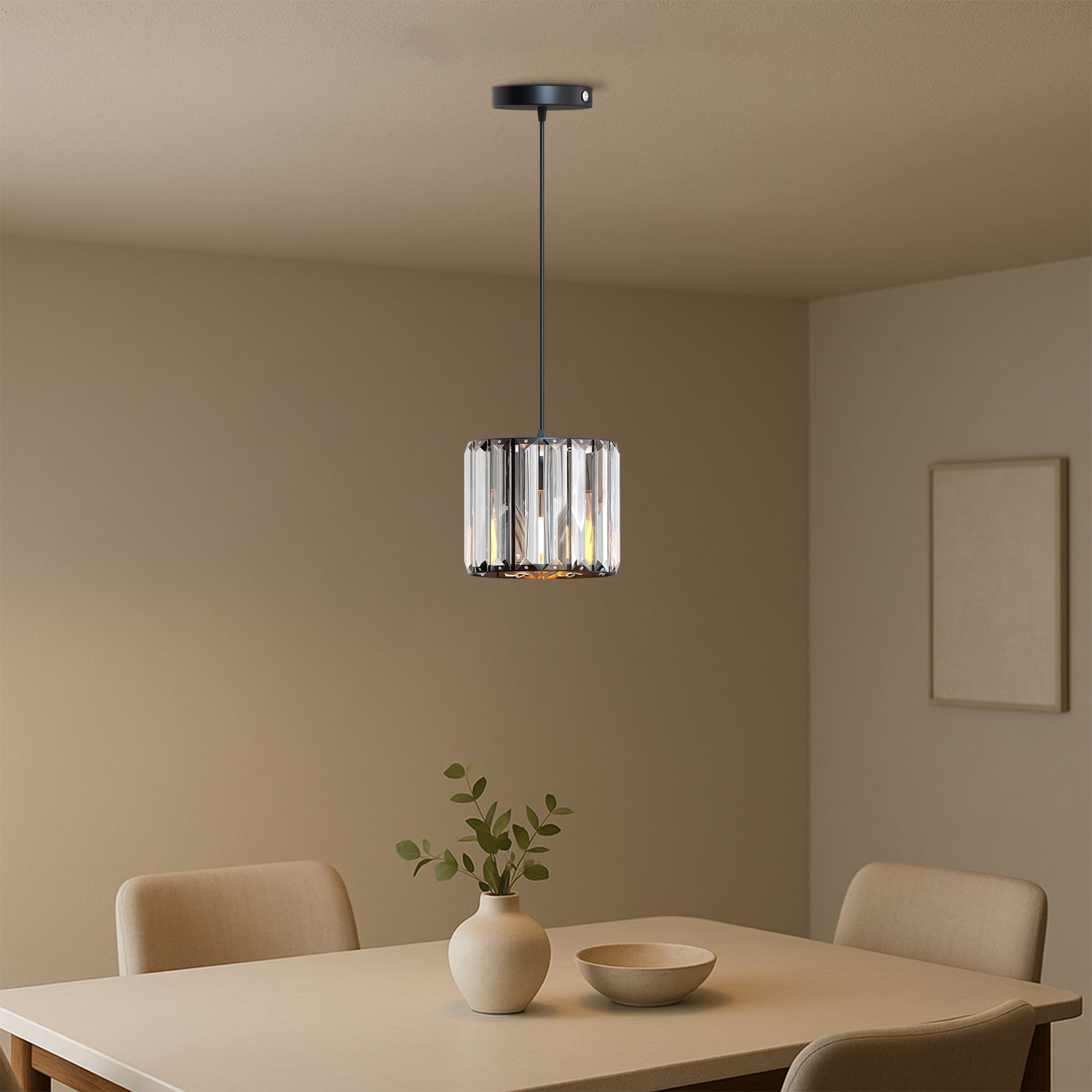 Modern pendant light hanging above a dining table with chairs in a room.