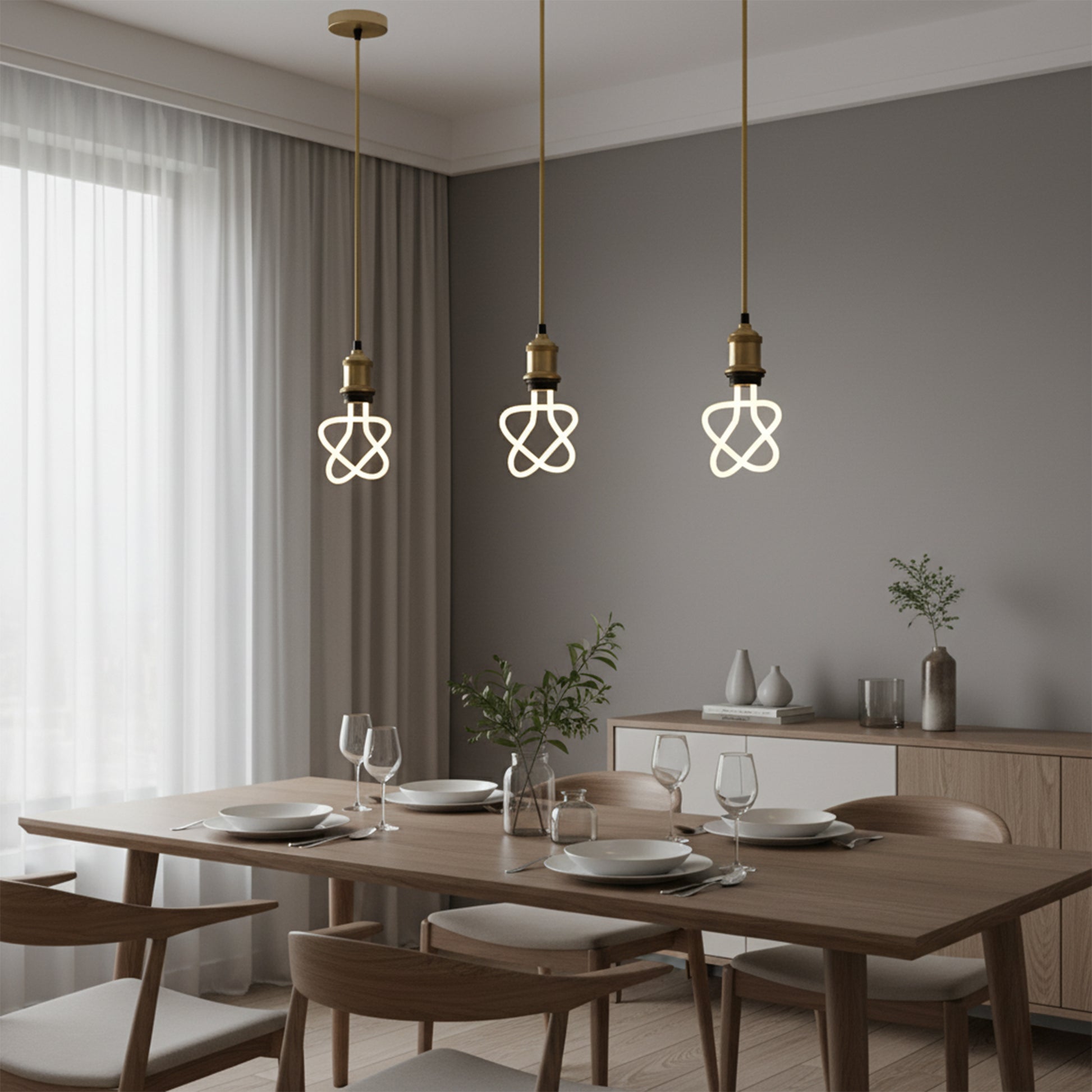 Dining room with wooden table, chairs, and modern pendant lights.