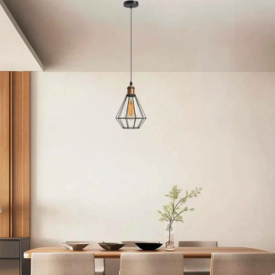Single head metal wire cage industrial pendant light hanging above dining table