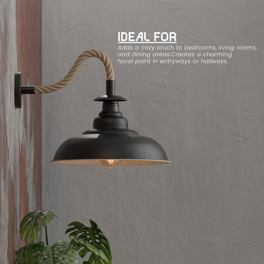 Black wall-mounted lamp with a rope design on a gray wall.