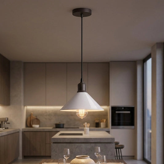 A modern kitchen and dining area with a large pendant light hanging over a wooden dining table set with plates and wine glasses. The background shows a contemporary kitchen with wood cabinets, a stone island, and large windows overlooking a city skyline.