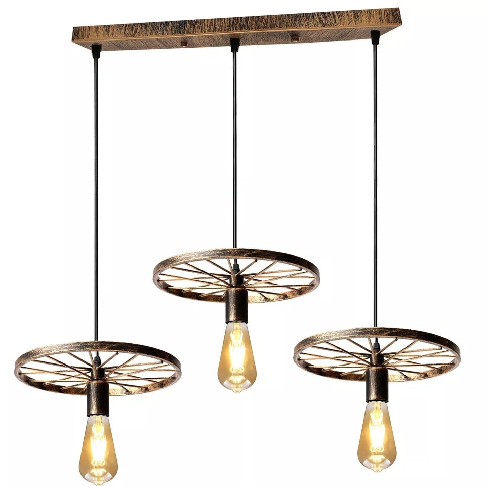 Three pendant ceiling lights with a vintage bike wheel 