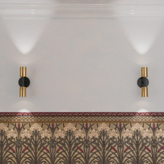 wall-mounted lights with a gold and black finish.