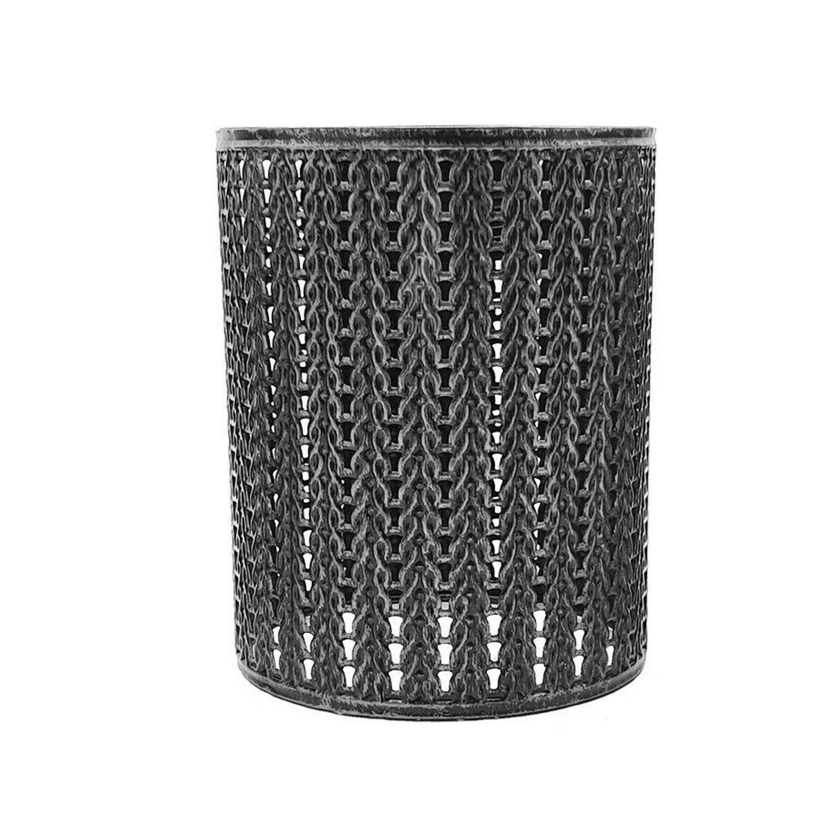 A metal cage lampshade pendant light fixture in a modern style, hanging in a room with a white wall and decorative plants.