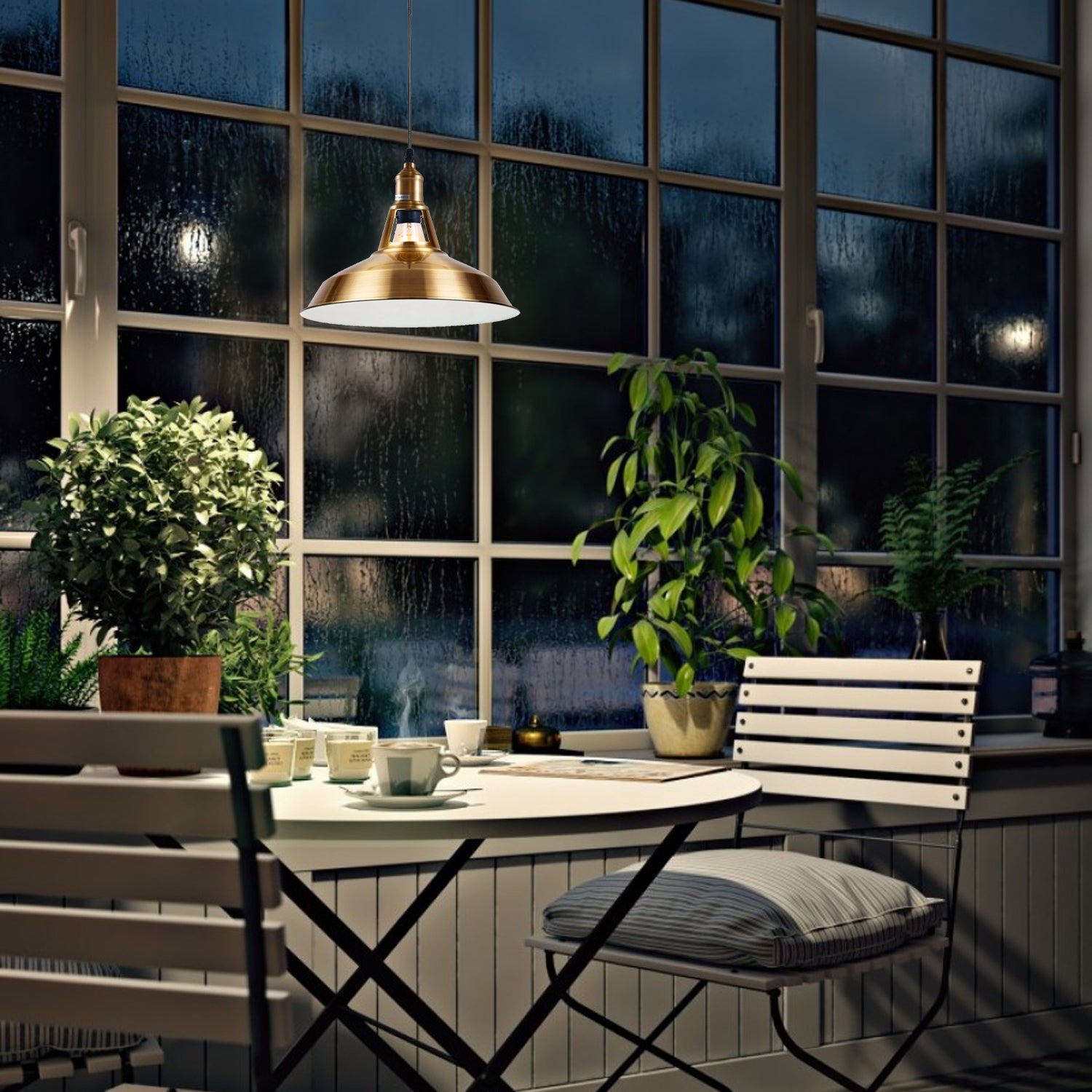Brass metal pendant light hanging above kitchen island